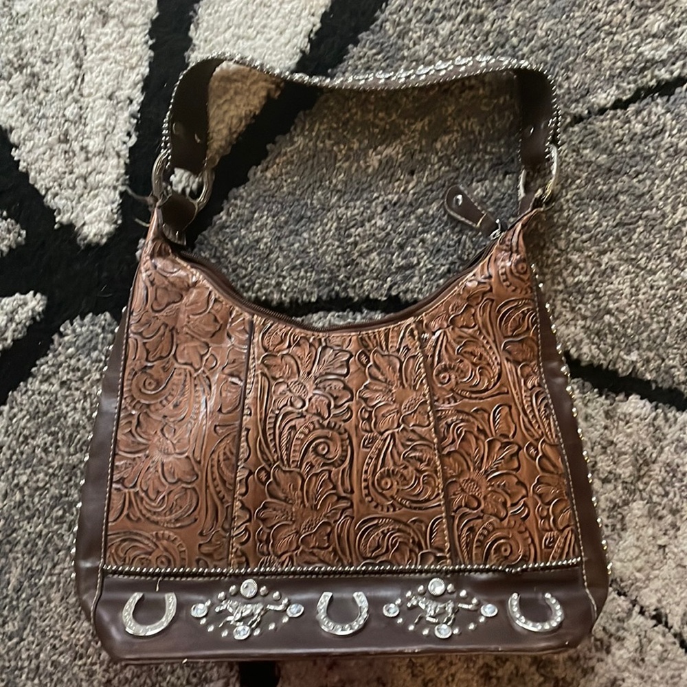 Western leather handbag. Brown with horse conchos.